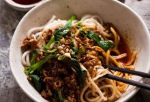 Bowl of spicy Sichuan Dan Dan Noodles, ready to be eaten